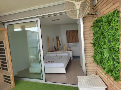 Katil atau katil-katil dalam bilik di Exclusivo Apartamento Spa privado frente el mar