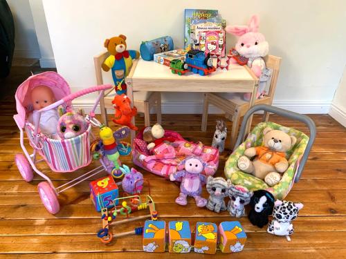 a group of stuffed animals and toys on the floor at Lovely nest in Nõmme in Tallinn
