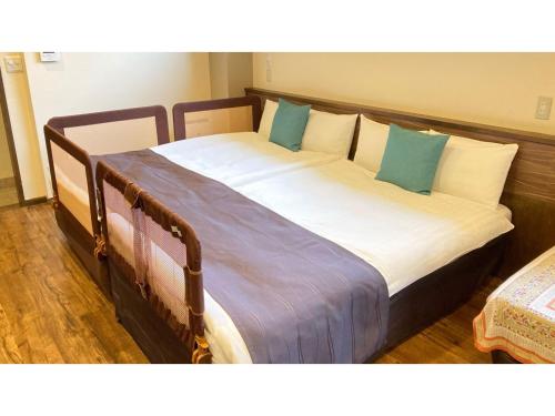 Tempat tidur dalam kamar di Fukugi Terrace - Vacation STAY 61841v