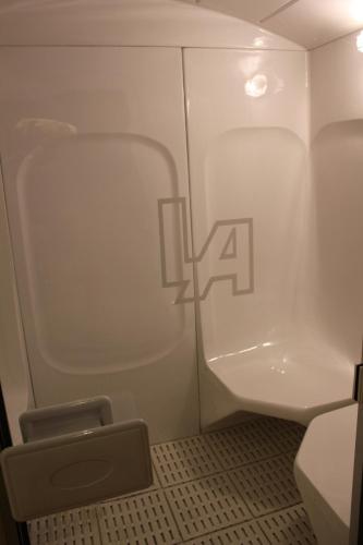 a small bathroom with a toilet and a sink at Hotel Leonor de Aquitania in Cuenca