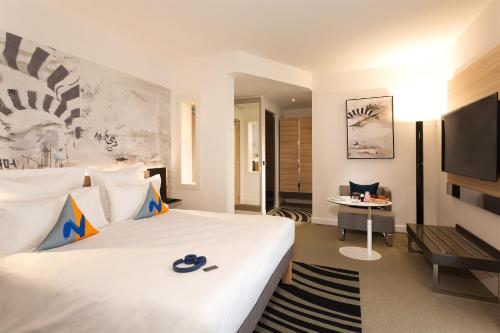 Un ou plusieurs lits dans un hébergement de l'établissement Novotel Tunis Lac