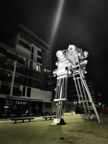 a robot is standing in front of a building at Nice and refreshing flat in Prague in Prague