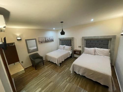 Postel nebo postele na pokoji v ubytování Gold Palace Hotel