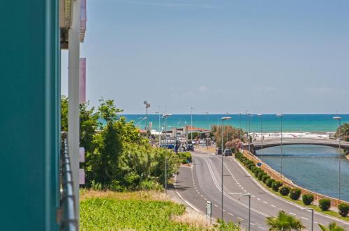 a view of a street with a bridge and a road at Hotel Viareggio in Viareggio
