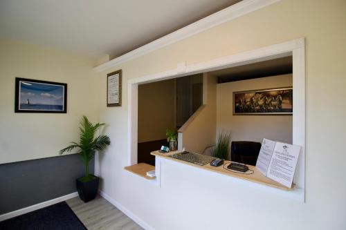 an office with a desk in the middle of a room at Oakdell Motel WATERFORD CT in Waterford