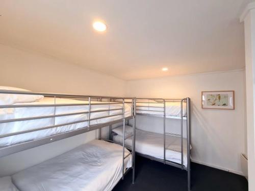 a room with two bunk beds in a room at Red Robin in Mount Hotham