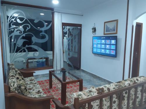 a living room with a couch and a window at German Dolphin in Quseir