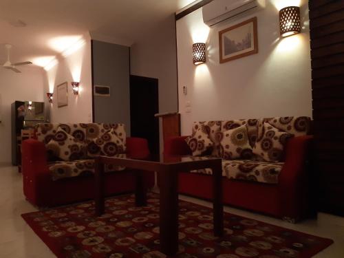 a living room with two couches and a table at German Dolphin in Quseir