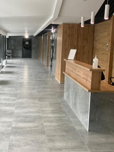 a hallway with a tile floor in a store at Люкс апартаменти в ЖК Театральному.Центр міста in Rivne
