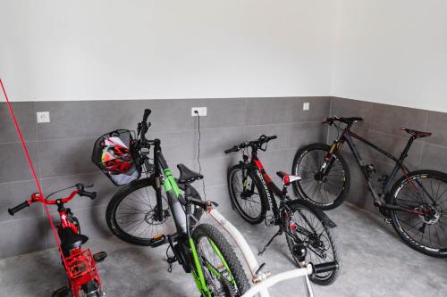 three bikes are lined up against a wall at Holzerhof-Ferienwohnungen in Gengenbach