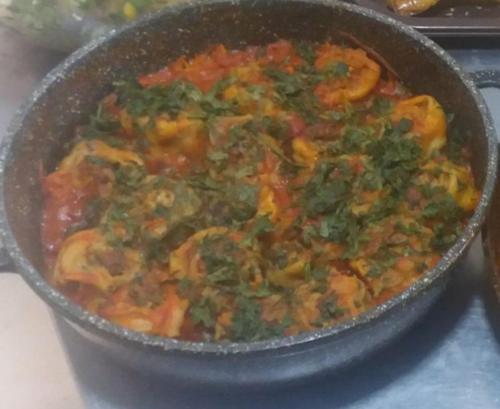 a pan of food on top of a stove at The land of Ararat in Yerevan