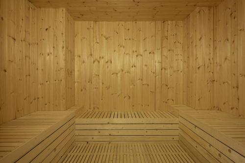 a rendering of a wooden sauna with wooden panels at Galini Palace in Kolymvari