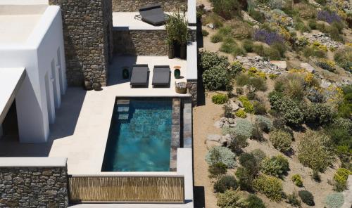 an aerial view of a villa with a swimming pool at Bonzoe Suites & Villas in Mýkonos City