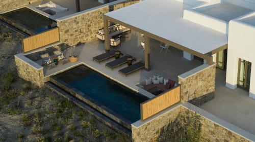 an overhead view of a house with a swimming pool at Bonzoe Suites & Villas in Mýkonos City
