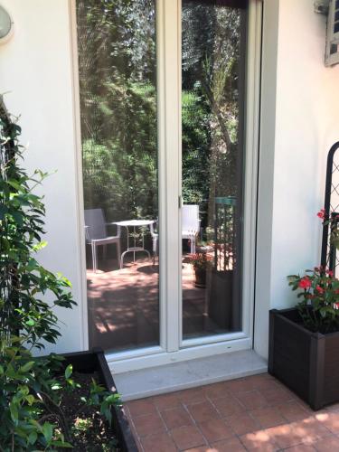 a sliding glass door leading to a patio at Villa Emma Malcesine in Malcesine