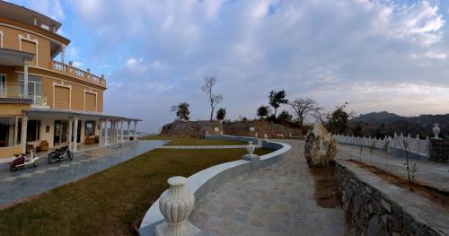 a view of a building with a wall and a yard at Fateh Safari Resort by Fateh Collection in Kumbhalgarh