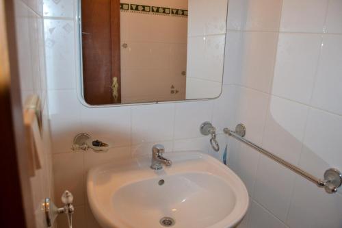 a bathroom with a sink and a mirror at Penzion Tučňák in Zábřeh