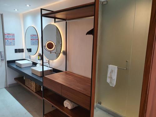 a bathroom with a sink and a mirror at Ximena Hotel Boutique in Sayulita