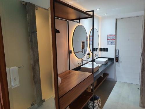 a bathroom with a sink and a mirror at Ximena Hotel Boutique in Sayulita