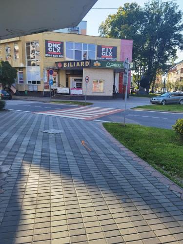 an empty street in front of a building at Apartmán RUŽA in Ružomberok