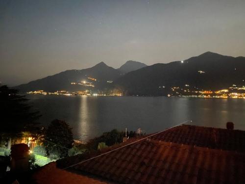 a view of a large body of water at night at CasaCamelia 35, 3 BDRM with view Lake Como in Acquaseria