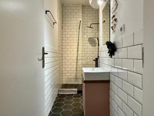a bathroom with a sink and a shower at B & B House Apartment in Athens
