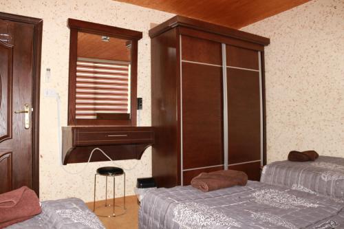מיטה או מיטות בחדר ב-Basant Villa