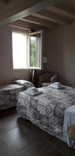 Postel nebo postele na pokoji v ubytování Agriturismo Vitae