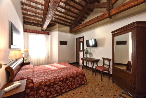 Postel nebo postele na pokoji v ubytování Locanda Casa Martini