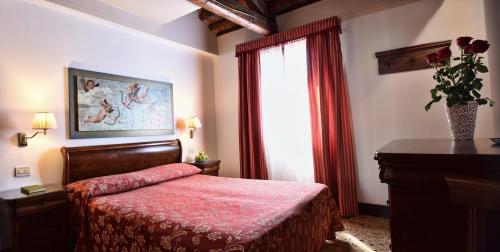 Postel nebo postele na pokoji v ubytování Locanda Casa Martini