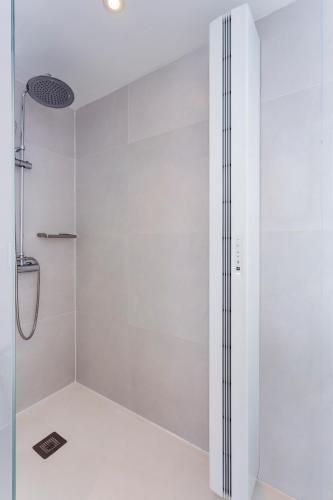 a white shower with a glass door in a bathroom at B&B HOTEL Madrid Centro Puerta del Sol in Madrid