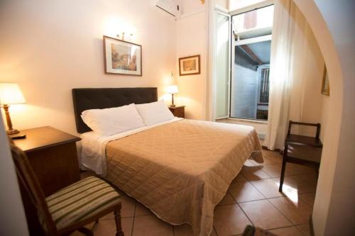 Een bed of bedden in een kamer bij Hotel Giubileo