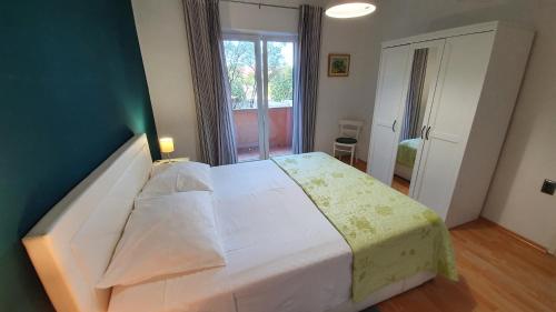 מיטה או מיטות בחדר ב-Apartments Nives