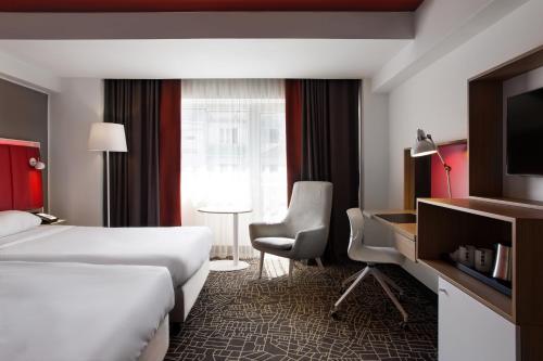 Letto o letti in una camera di Park Inn by Radisson Bucharest Hotel & Residence