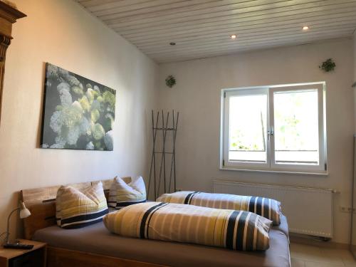 Ein Bett oder Betten in einem Zimmer der Unterkunft Ferienwohnungen In de goldisch Luft