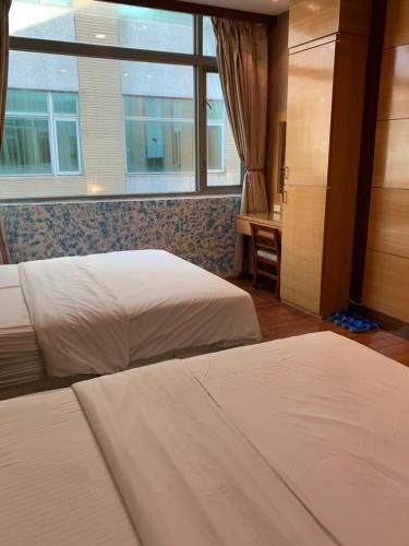 Ένα ή περισσότερα κρεβάτια σε δωμάτιο στο Charming Motel