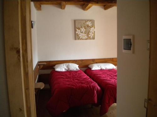 Llit o llits en una habitació de La Tieda - locazione turistica Reolon