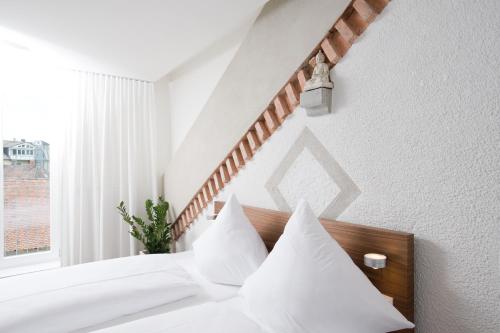 Ein Bett oder Betten in einem Zimmer der Unterkunft Hotel Constantia