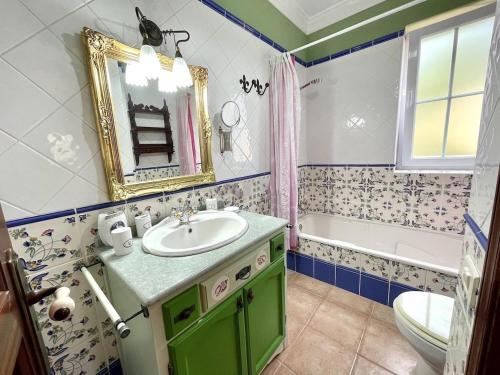 a bathroom with a sink and a tub and a mirror at CASA Mar y Teide in Sauzal