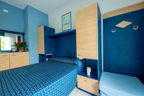 Postel nebo postele na pokoji v ubytování Hotel Olanda