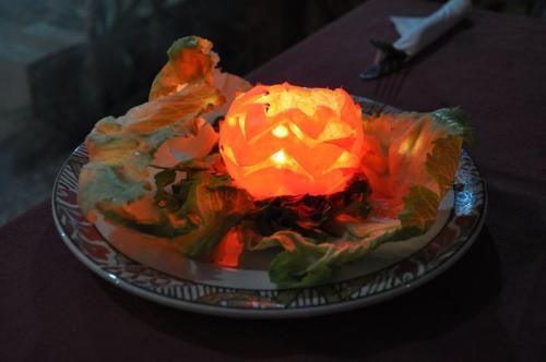 a carving of a pumpkin on a plate on a table at El Mesala Hotel in Luxor