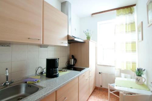 a kitchen with a sink and a counter top at Zellerfelder Hof in Clausthal-Zellerfeld