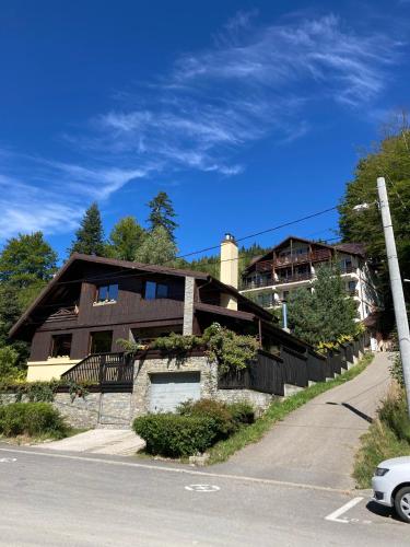 a house on the side of a road at Lucas Duplex in Azuga