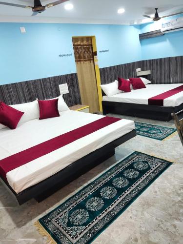 Ένα ή περισσότερα κρεβάτια σε δωμάτιο στο Chakravarthy Holidays