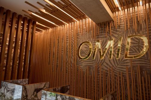 a room with a wall with the word curry on it at OMID Saldanha Hotel in Lisbon