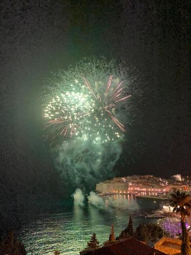 a fireworks display over a body of water at night at Pearl of Adriatic in Dubrovnik