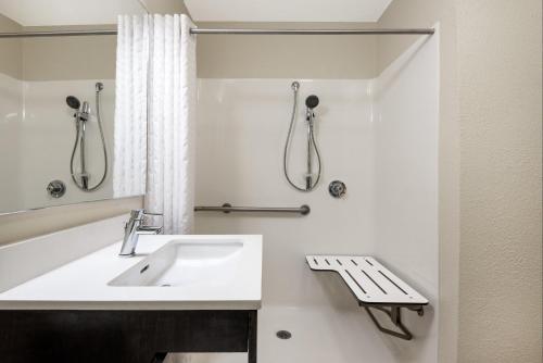 a bathroom with a sink and a shower at Candlewood Suites Destin-Sandestin Area, an IHG Hotel in Destin