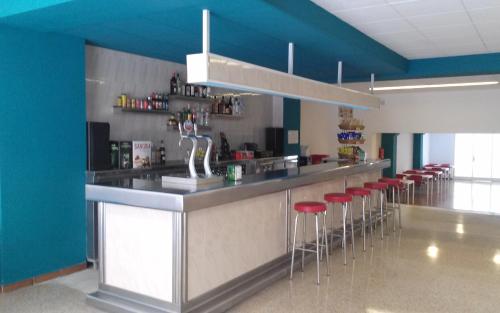 The lounge or bar area at Hostal San Carlos