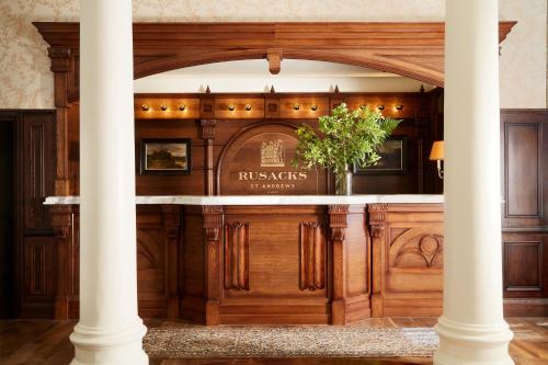 a bar in a building with a pillar at Rusacks St Andrews in St. Andrews