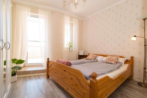 Posteľ alebo postele v izbe v ubytovaní Francesca Apartmanlakása